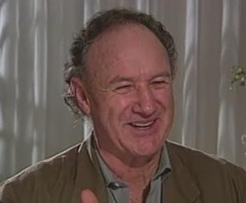 Gene Hackman w jednej ze swoich ikonicznych ról filmowych, ukazujący intensywność i siłę jego kreacji aktorskich.